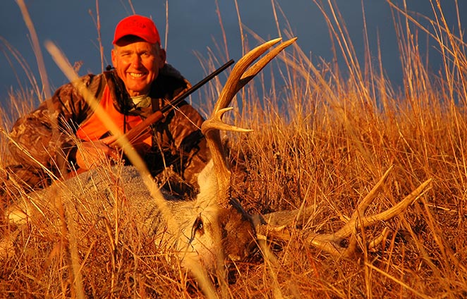 Long shot? No. Wayne killed this tall-grass Nebraska buck at 100 yards, prone from a shallow rise.