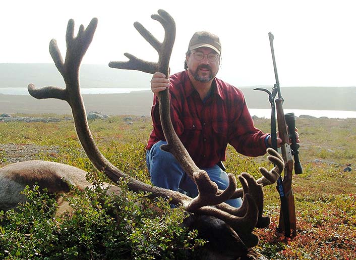 Walnut-stocked rifles still take big game now and then, even caribou, which live in wet climates. Luckily, on this day the sun was shining.
